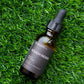 Bottle of 'Rough Rider' beard oil from The Beard Co. on grass