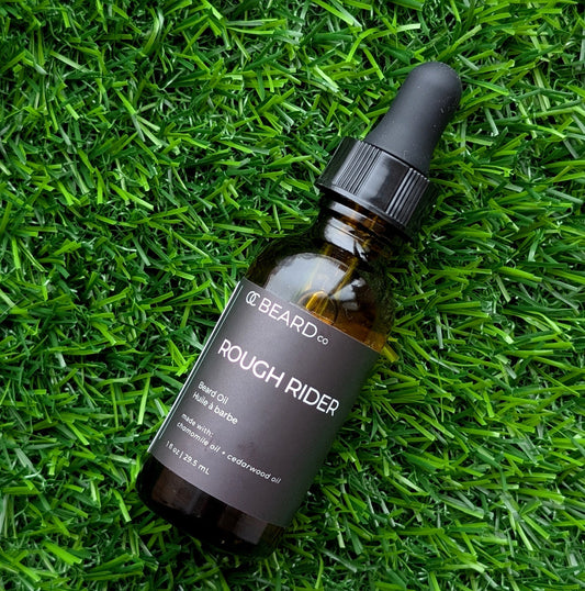 Bottle of 'Rough Rider' beard oil from The Beard Co. on grass
