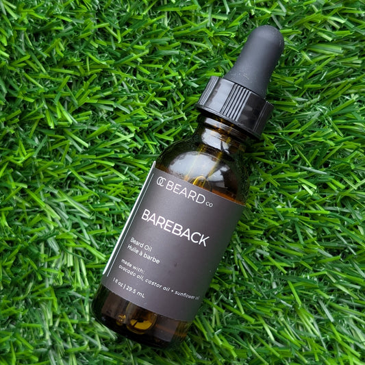 Bottle of CC Beard Co. Bareback beard oil on grass